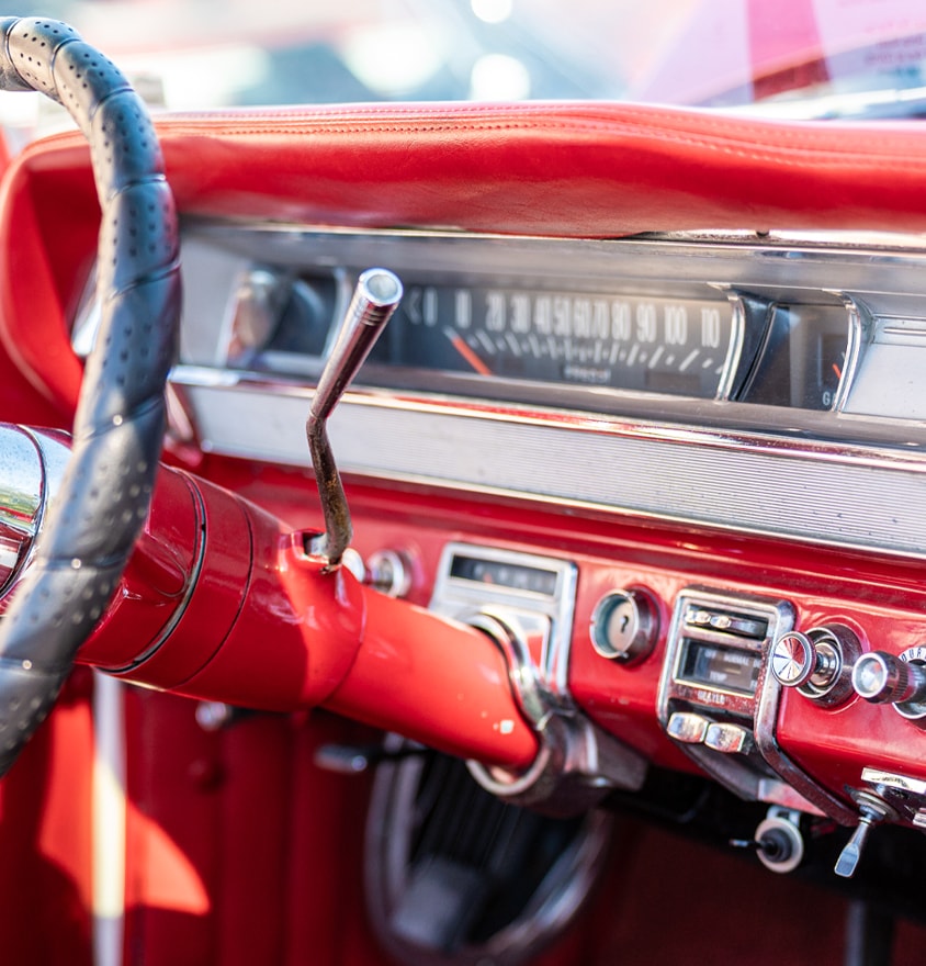 Red interior dashboard of a vintage classic car