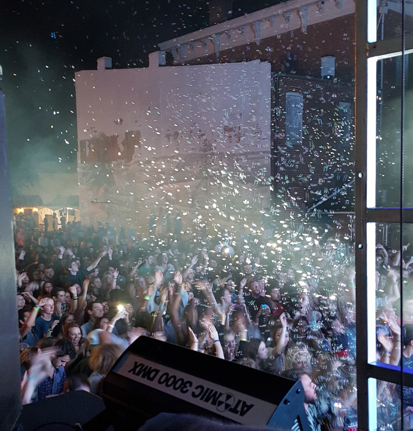 Confetti falling over concert crowd celebration