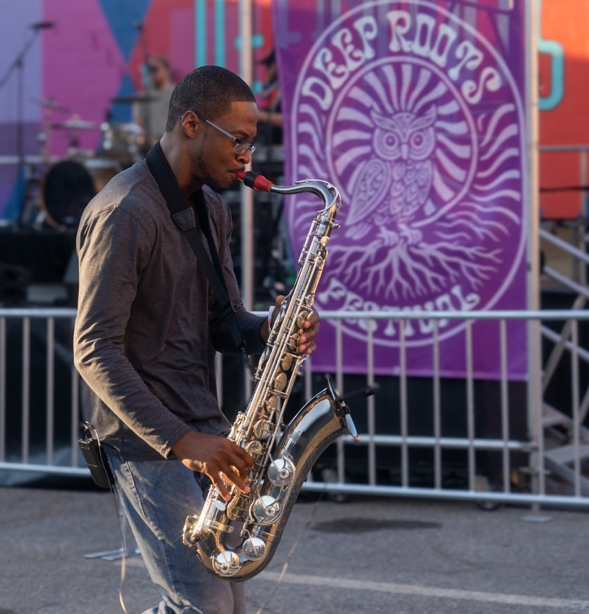 Musician playing saxophone street performance